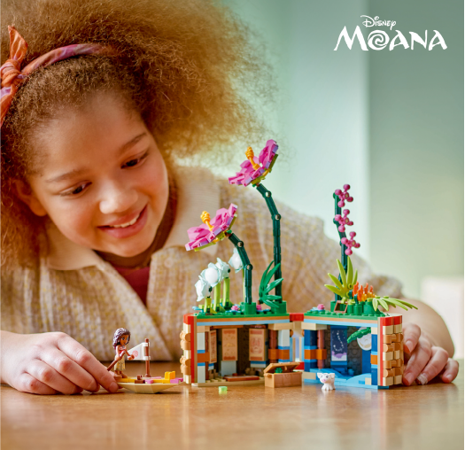 A child playing with Moana themed toys.