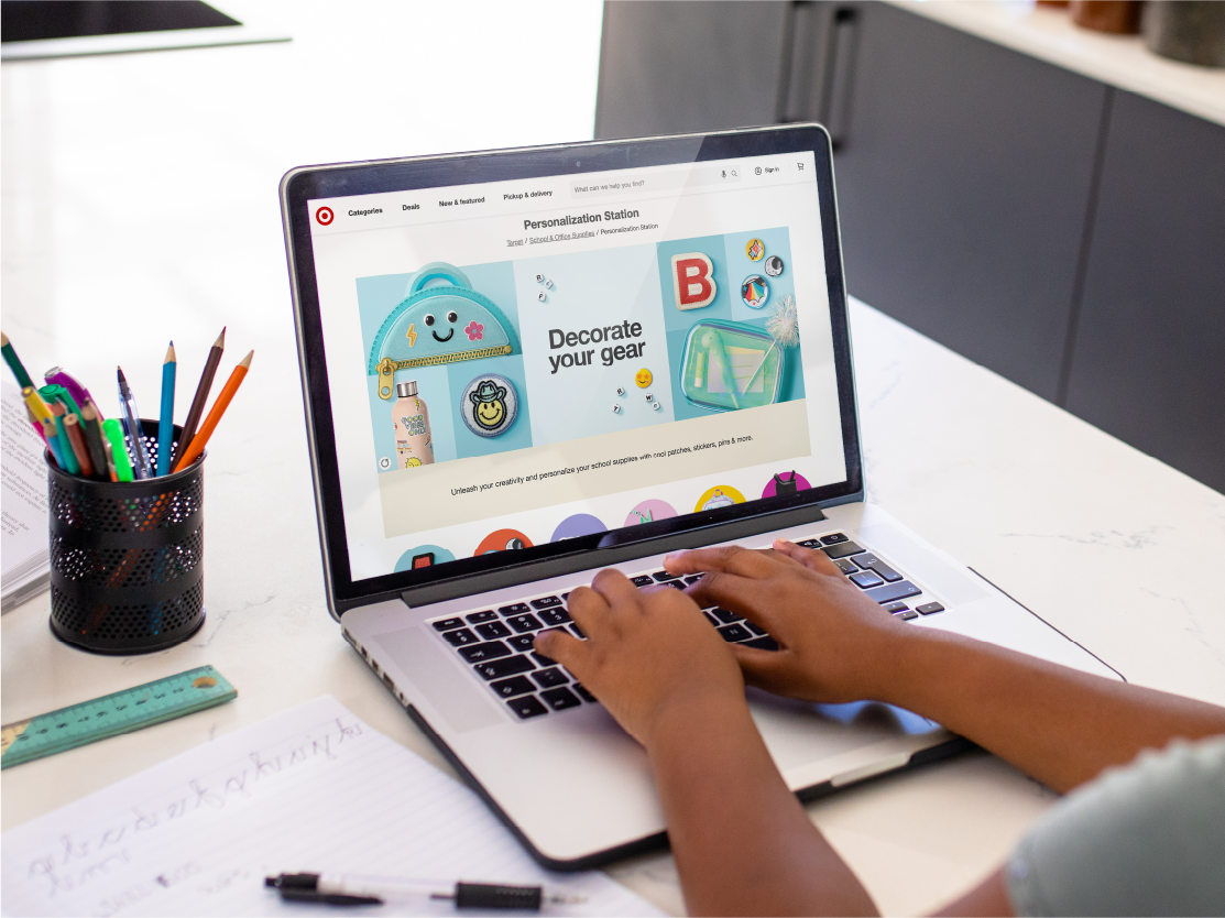 A guest browses the Personalization Station on Target.com on a laptop.