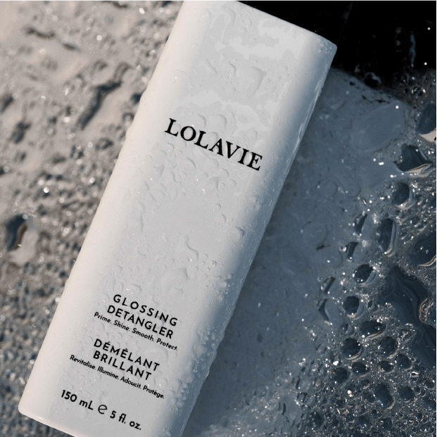 A bottle of LolaVie Glossing Detangler.