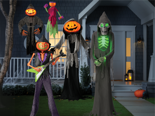 Lewis the Pumpkin Ghoul surrounded by Pumpkin Rocker Billy, Little Lewis, Pumpkin Iron Lewcy and Bruce the Skeleton Ghoul, in front of a house.