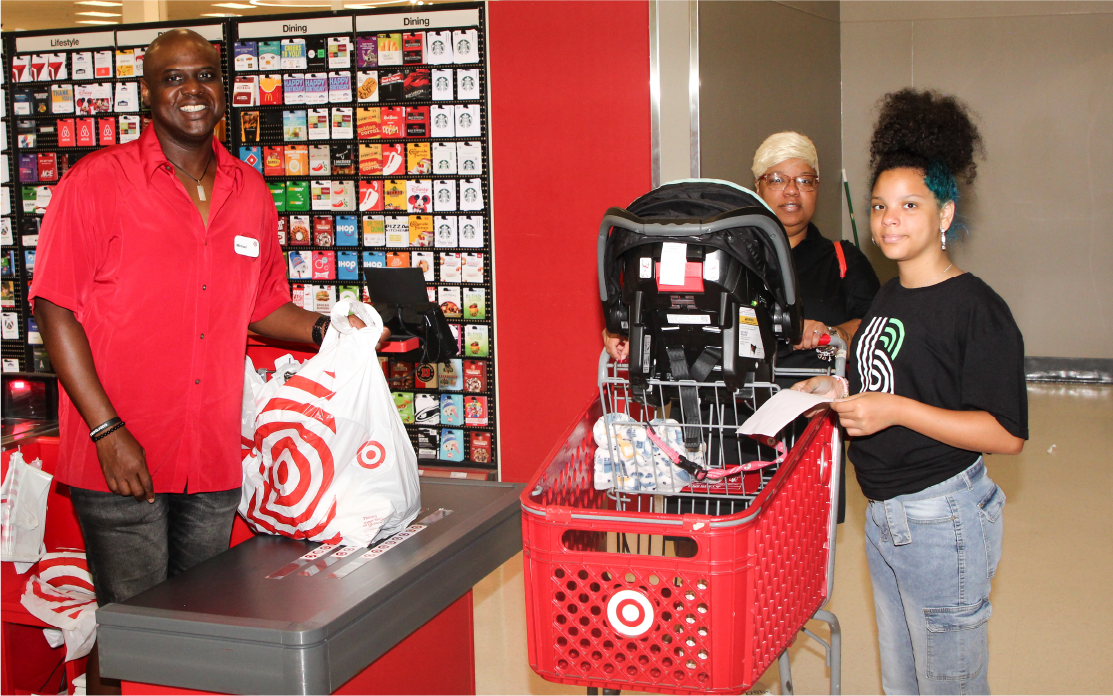 A Big and Little pair check out at a Target store.